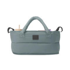 Three open compartments keep bottles, wipes, and snacks organized.