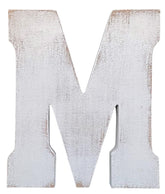 ABELOTS large wood letter M in distressed white wash stands as rustic wall decor.