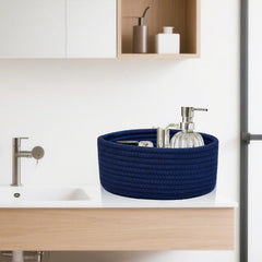 ABenkle nursery side table basket organizes toys and diapers softly.