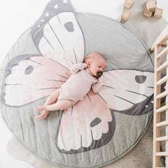 ABREEZE butterfly design pattern on round play pad enhances nursery decor.