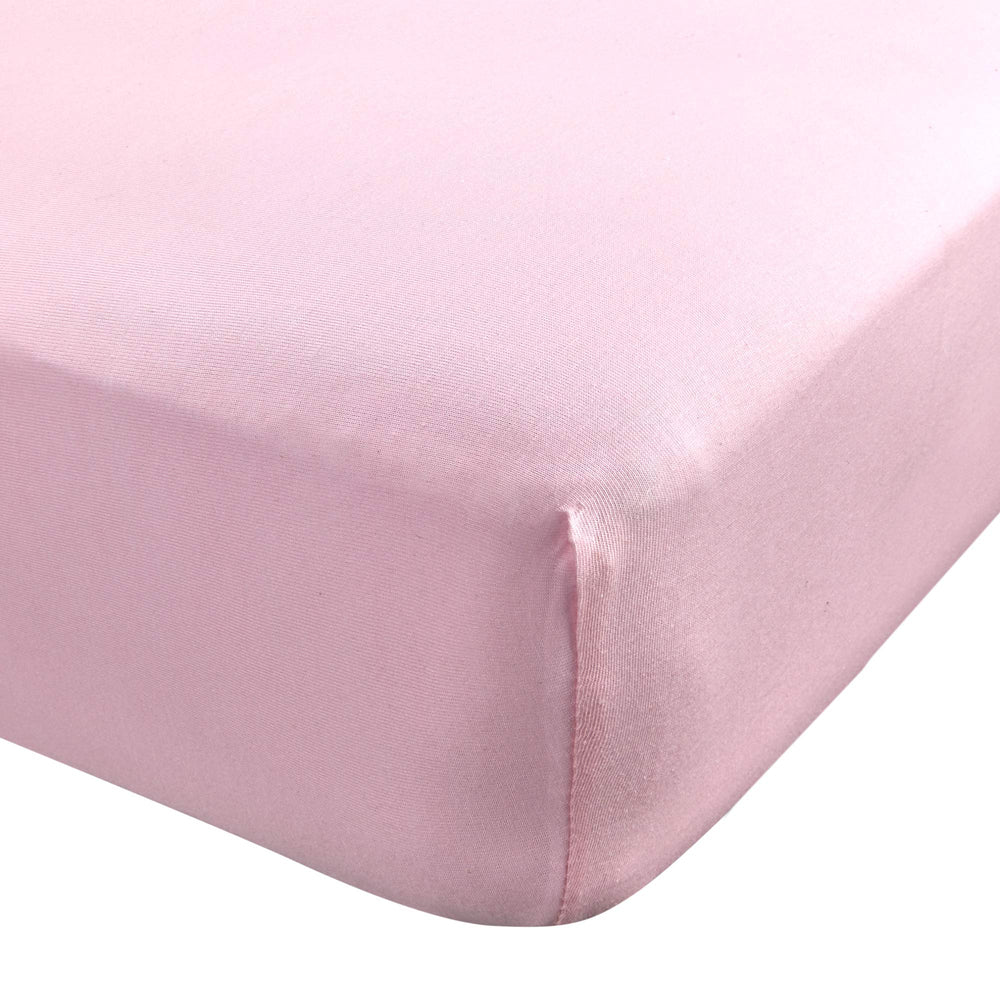 Abstract Cotton Crib Sheet in solid pink offers a soft touch for baby sleep.