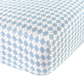 Abstract cotton crib sheets with blue argyle pattern for cozy nights.