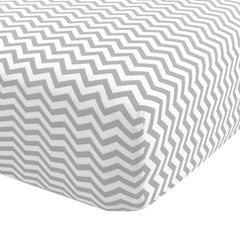 Abstract Cotton Crib Sheets gray zigzag folded for a soft, cozy nursery look.