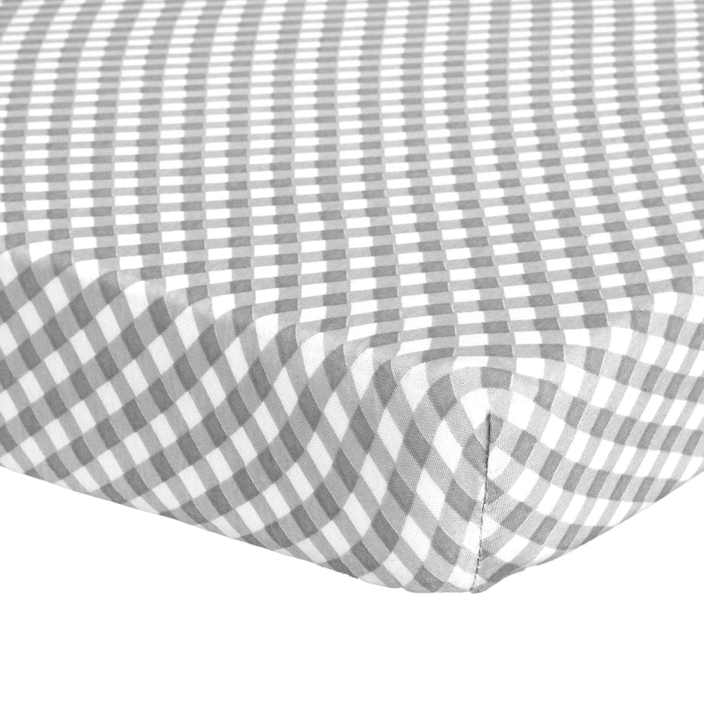 Abstract Mini Crib Sheets in checkered gray offer soft comfort and a snug fit for crib mattresses.