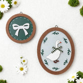 AceOrbit silly goose wall art with green bow adds playful nursery charm.
