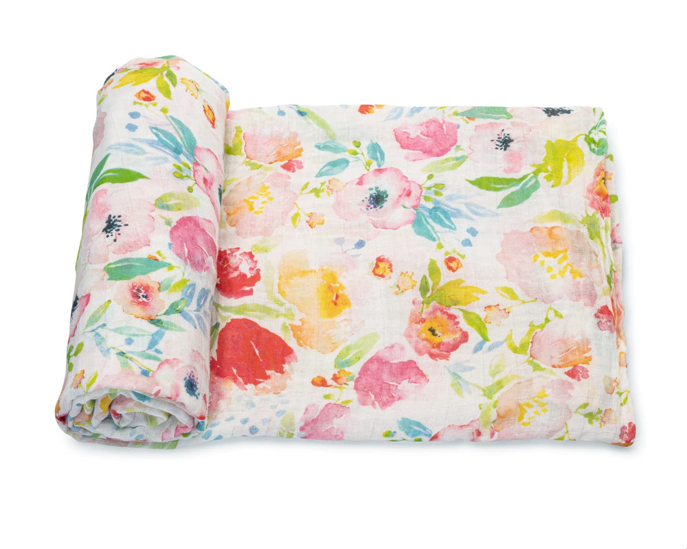 Addisson Belle swaddle with watercolor floral pattern offers breathable muslin comfort for newborns.