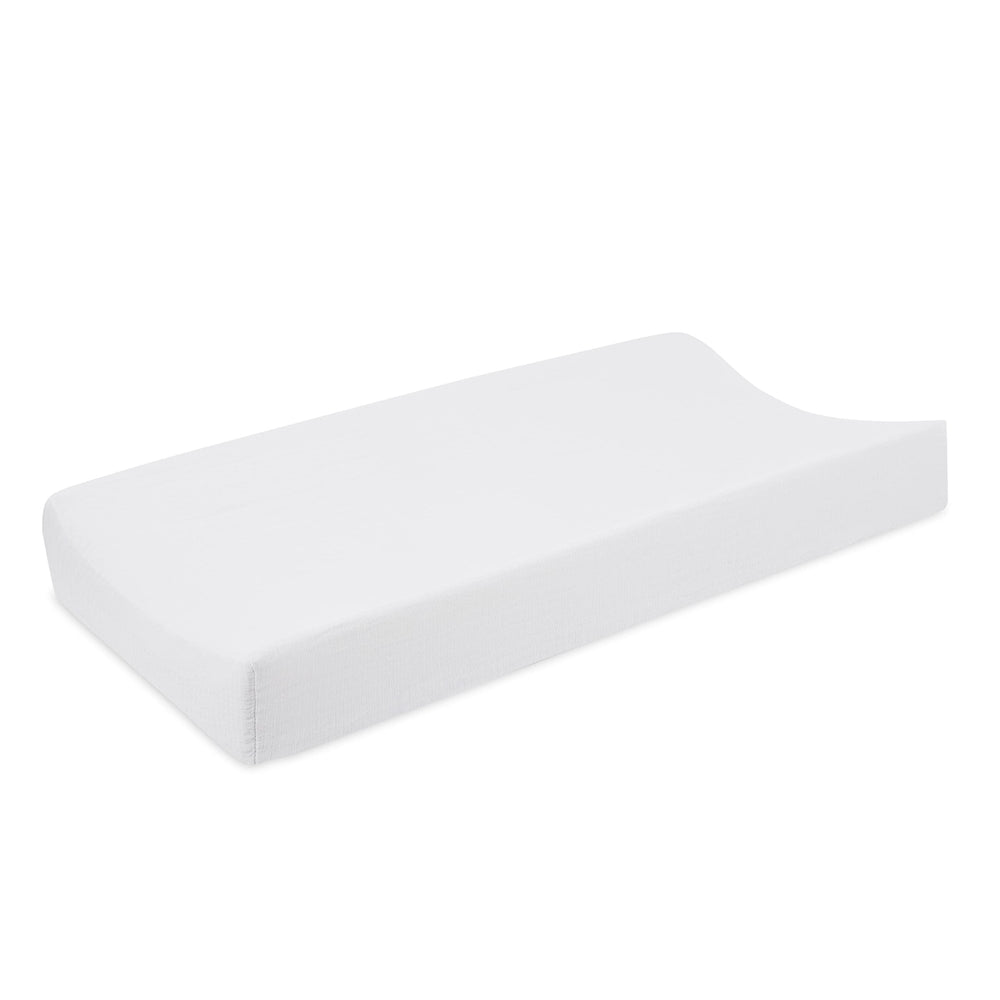aden and anais Essentials changing pad cover in soft muslin close-up for baby comfort.