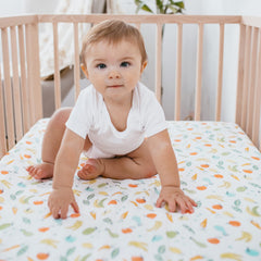 aden + anais Essentials crib sheet snug fit demonstrates secure, tailored protection for standard crib mattresses