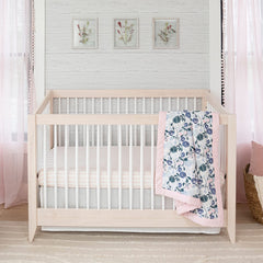aden + anais Essentials crib skirt coordinates with nursery decor for a polished look