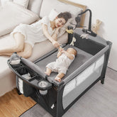 Afgbf 5-in-1 Pack and Play bedside sleeper with easy night-time access.