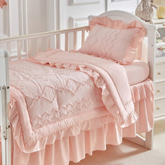 AIKASY ruffled crib bed skirt in coral pink adds soft visual depth and tidy finish.