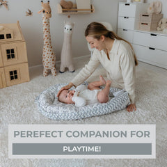 Aila+Aiden baby lounger in use during supervised tummy time and changes.