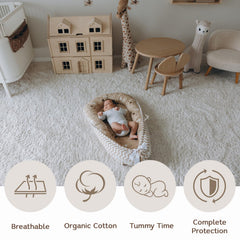 Aila+Aiden baby lounger with convenient travel handles for portability.