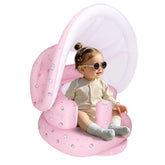 AirSwim inflatable baby seat with detachable canopy provides shade for outdoor play.