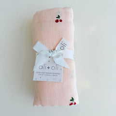 Ali+Oli cherry swaddle makes a thoughtful baby shower gift.