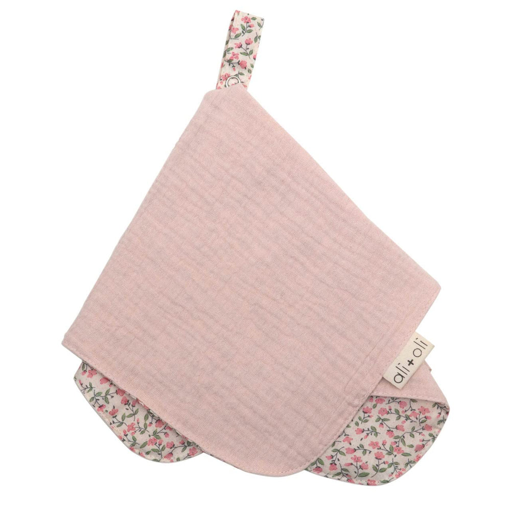 Ali+Oli pacifier blanket holder with pink flowers and snap closure for easy one-handed use.