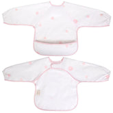 Ali+Oli Smock Bib pink flowers long-sleeve on baby for mess-free feeding.