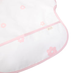 Ali+Oli pink flowers smock bib worn by a baby at mealtime