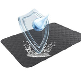Alsunny waterproof bed pad laid flat, protecting beds from spills.