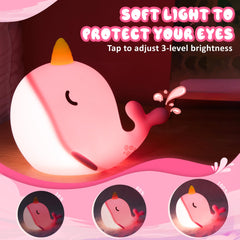 Ammonite Pink Narwhal Night Light on USB charging for travel-ready setup