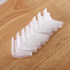 Angloria corner protector on wood table edge protects from bumps