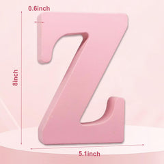 AOCEAN pink wood letter wall decor adds charm to kids' rooms.
