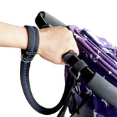 APBFH baby stroller wrist strap with blue stitching adds extra safety during outings.