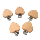 Arakierst beech wood pacifier clip in heart shape keeps pacifiers handy on the go.