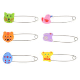 ARTSEWPLY diaper pins closeup with plastic safety head for gentle, secure fastening.