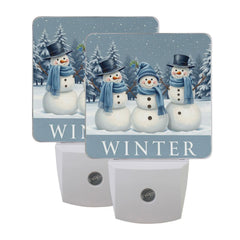 Aslsiy snowman night light in a snowy forest providing gentle guidance for bedtime.