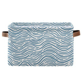 Aslsiy ocean wave doodle basket for organized nursery spaces.