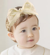 Asphinien Ivory Lace Headband with bow closeup for a refined newborn look