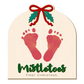aukolass baby's first christmas footprint sign offers keepsake art for newborn milestones.