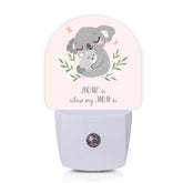 Axxitude koala mom and baby night light plugged in for a gentle kids' room glow.