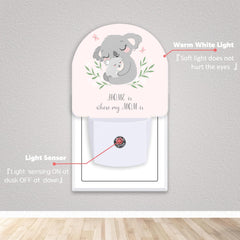 Axxitude round night light with dusk-to-dawn sensor providing automatic night illumination.