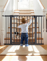 BABELIO baby gate walk-through door for easy one-handed access.
