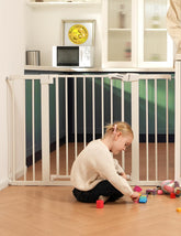 BABELIO metal baby gate with walk-through door for easy, safe passage.
