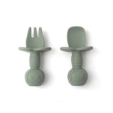 Babies and Cuties toddler fork and spoon set with anti-choke shield for safe self-feeding.