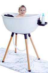 Babu Bath luxury baby tub on a wooden stand for comfortable newborn bathing.