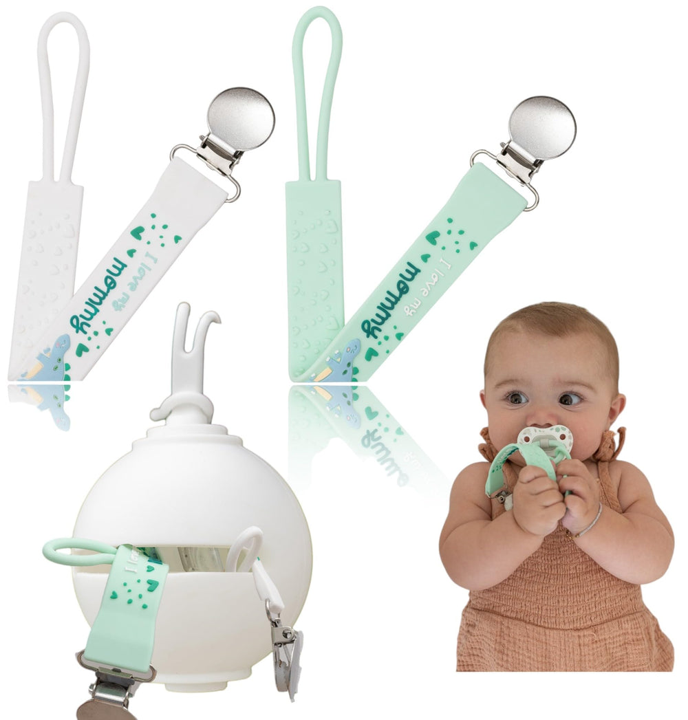 Baby Amy pacifier holder clip in white and green keeps pacifiers secure and clean.
