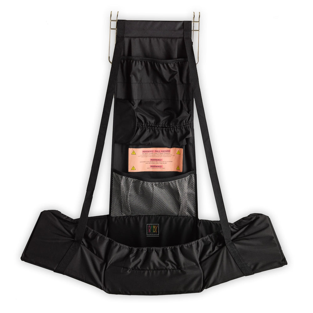 Baby Change-N-Go travel station shown over a door for private diaper changes.