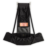 Baby Change-N-Go travel station shown over a door for private diaper changes.