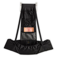 Baby Change-N-Go travel station shown over a door for private diaper changes.