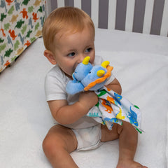 Baby Essentials Minky Dino Lovie Dude provides tactile fun and comfort during rest.