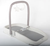 Baby Woyee Duraking Pro changing pad with toy bar provides a secure surface.