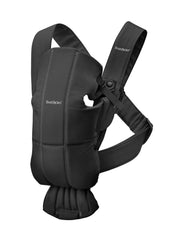 BabyBjörn Carrier Mini in black woven fabric provides soft, close contact for newborns.