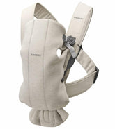 BabyBjörn Baby Carrier Mini front view shows ergonomic support for newborns