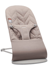 BabyBjörn Bouncer Bliss with cotton petal quilt in sand gray provides cozy newborn seating.