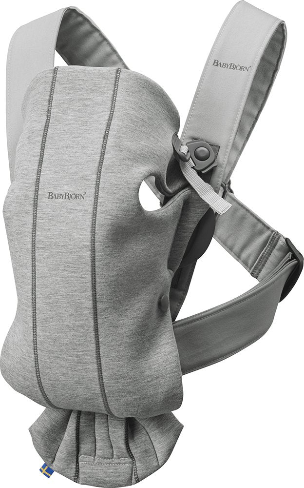 BabyBjörn Mini carrier in light gray front view with ergonomic newborn support.