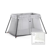 BabyBjorn Travel Crib Light in silver with quick setup for on-the-go families.